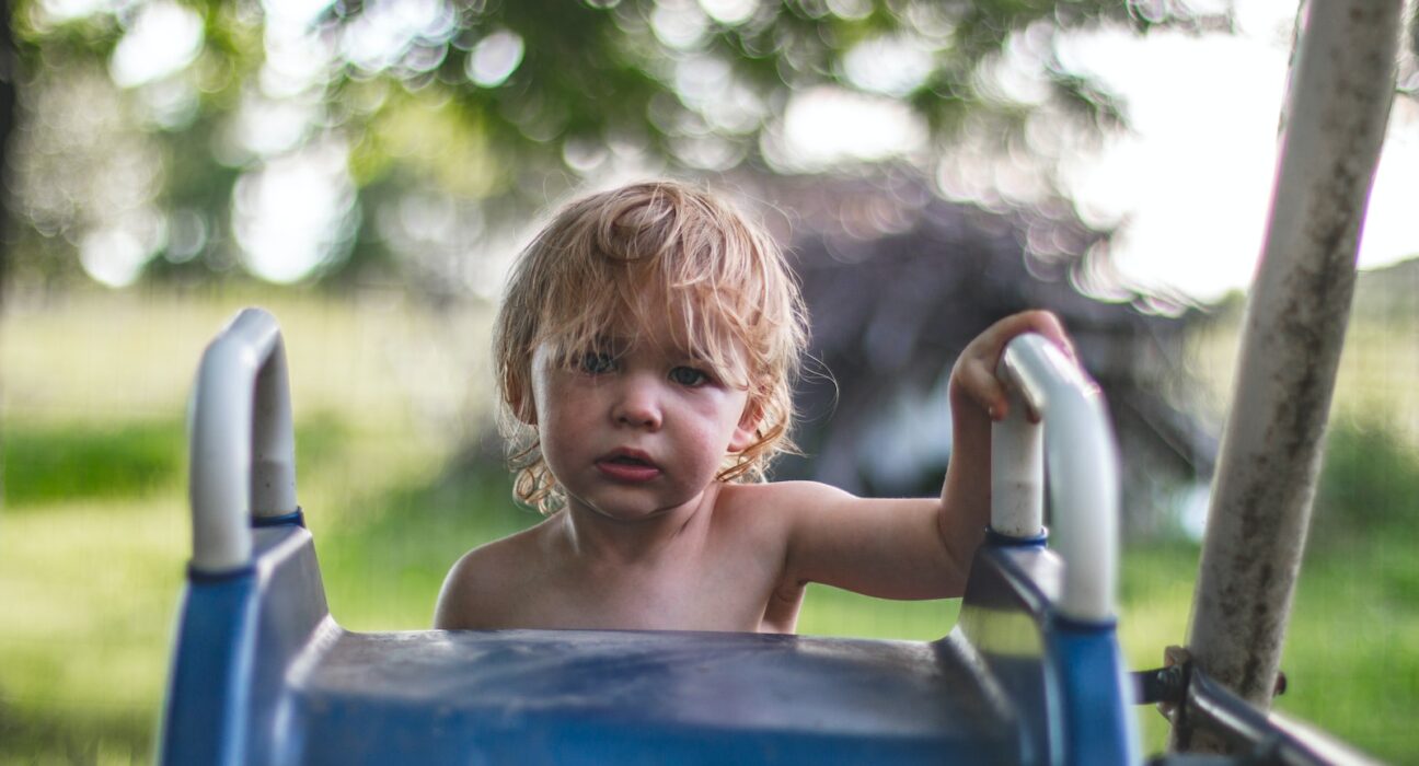 children climbing on slide