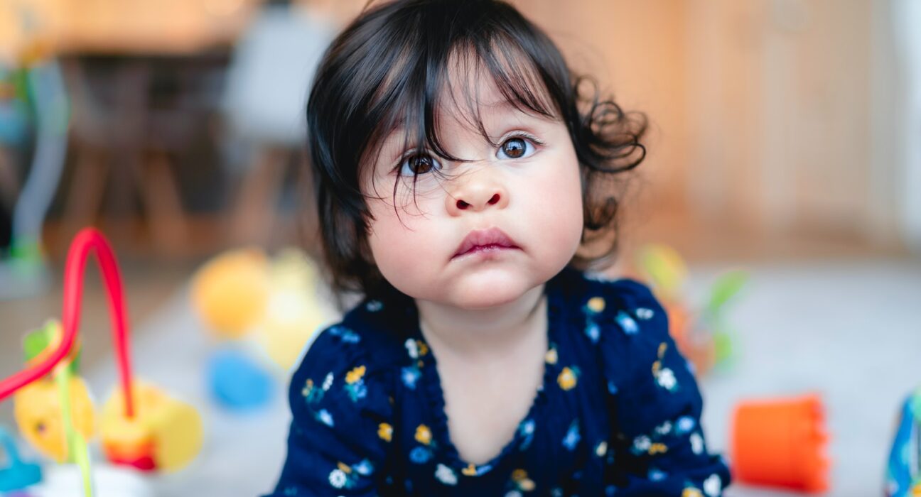 girl wearing blue floral blouse
