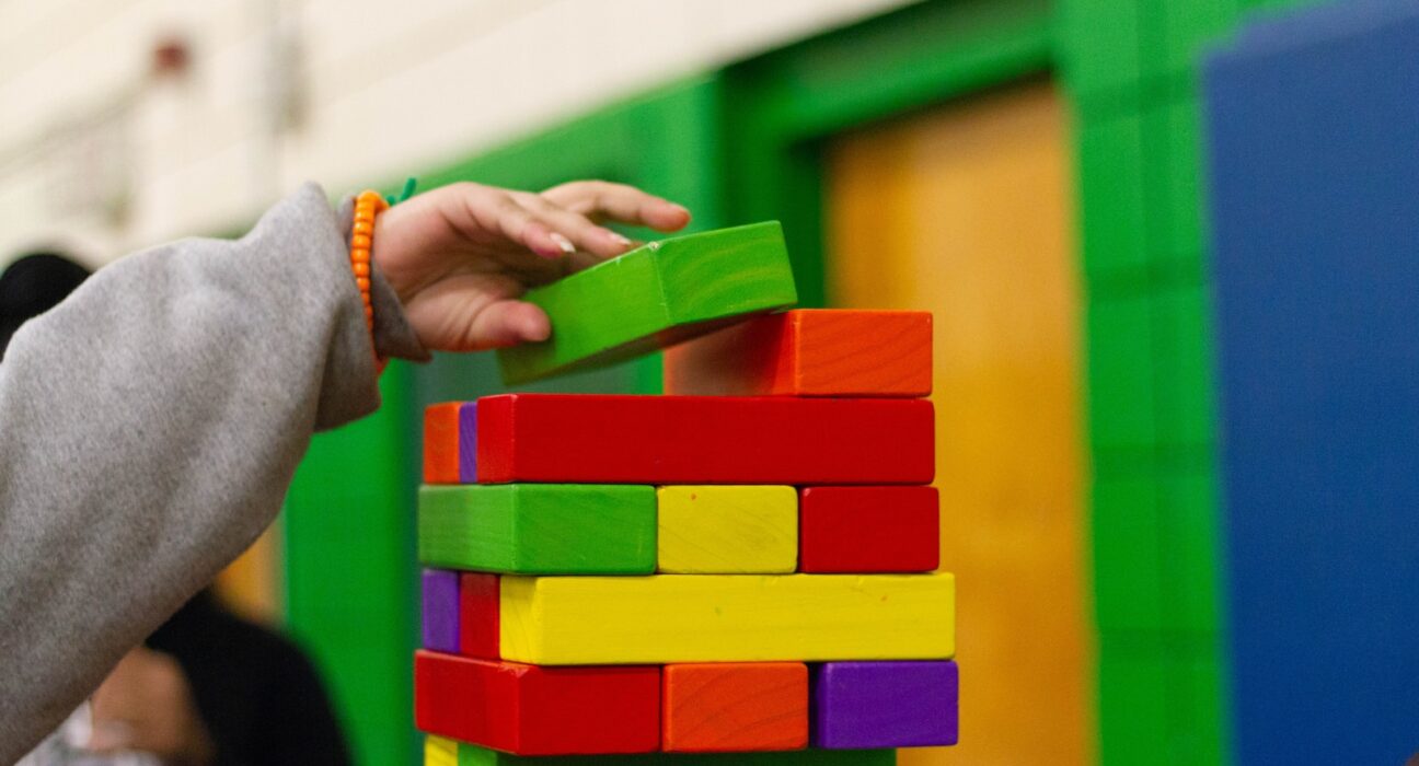 person piling blocks